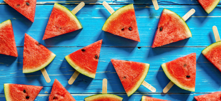 watermelon popsicles with blue background