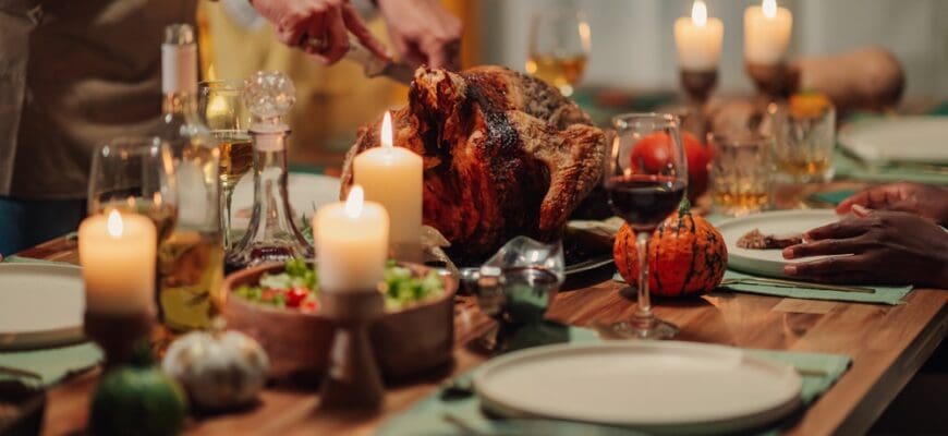 Family,Members,Carving,And,Serving,A,Roasted,Turkey,During,A